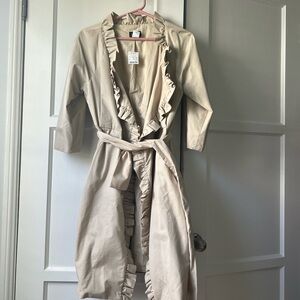 Tan/cream coat trench style.